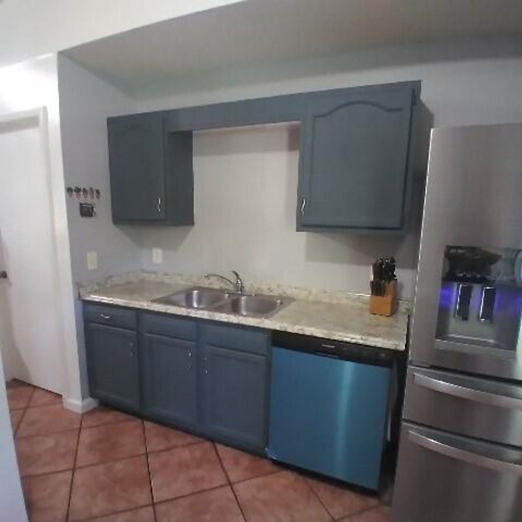 Photo of 1673 SW Mullinax Avenue, Port Saint Lucie, FL 34953 (MLS # R10985555)