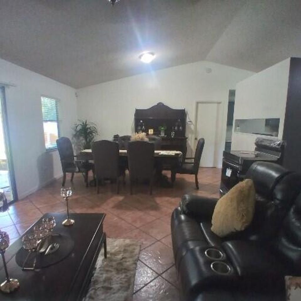 Photo of 1673 SW Mullinax Avenue, Port Saint Lucie, FL 34953 (MLS # R10985555)