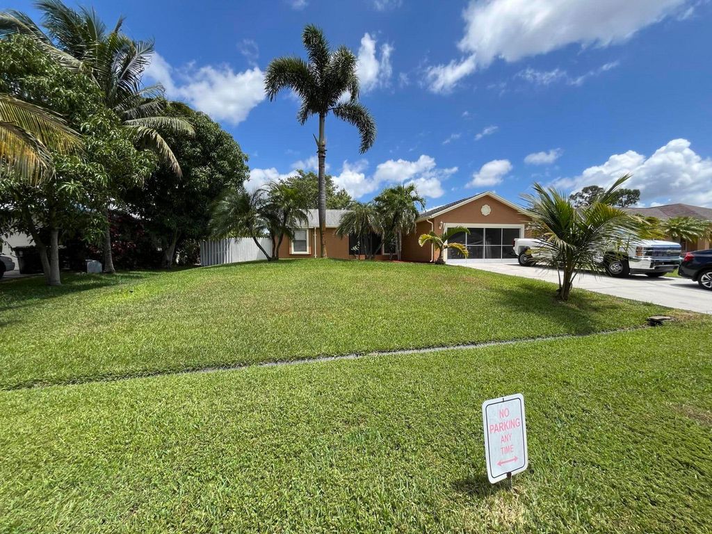 Photo of 1673 SW Mullinax Avenue, Port Saint Lucie, FL 34953 (MLS # R10985555)