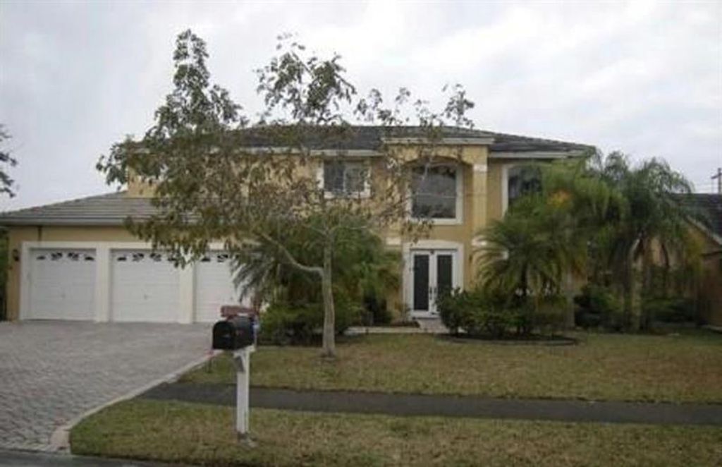 Photo of 4821 KENSINGTON CIR, Coral Springs, FL 33076 (MLS # F10282149)