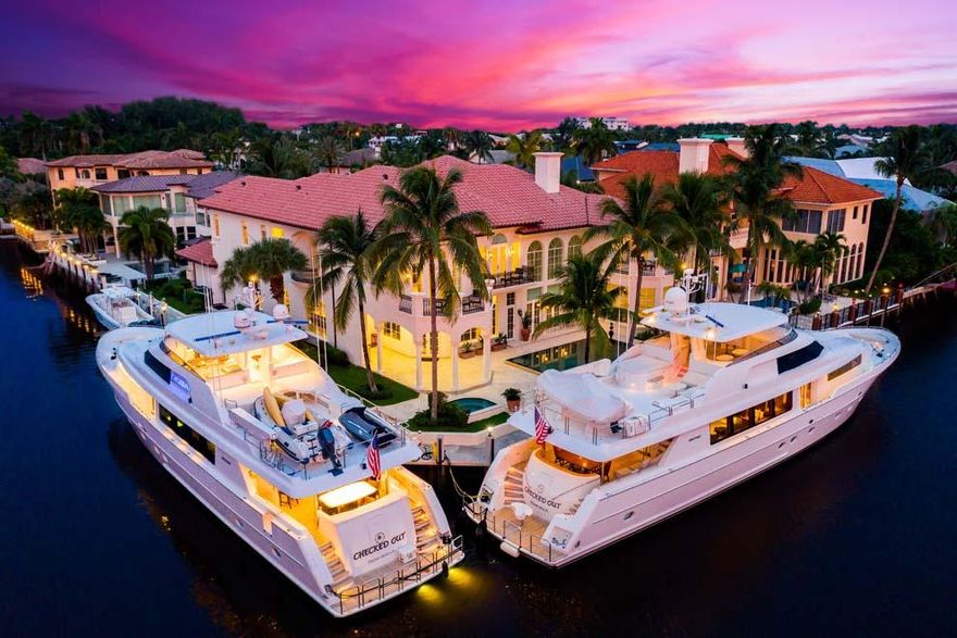 Located on a point lot with over 240 feet of Intracoastal waterfrontage, 1003 Rhodes Villa Avenue offers exceptional South Florida luxury living. Boasting over 11,300 total square feet, the six bedroom residence is tucked away at the end of a quiet cul-de-sac one block from the beach and about a mile from the shops and restaurants of Atlantic Avenue. Serious boaters will appreciate the Intracoastal waterfrontage in a no-wake zone with expansive private dock for multiple yachts and boats. Features include formal living and dining rooms; theater; large kitchen; loft; walls of French doors and windows overlooking the pool, grounds and Intracoastal; balconies; covered loggia with summer kitchen; four-car garage and elevator. Enjoy the beach area in this rare point lot waterfront estate. Distinguished with an East Delray Beach address, this property is complimented by the impressive point lot with 243 feet of Intracoastal waterfrontage in a no-wake zone and two nearby inlets for ocean access. Enjoy the beach just one block to the east and the boutiques and eateries of East Atlantic Avenue just over a mile to the north. Plan outings to Palm Beach, Boca Raton and Fort Lauderdale along scenic A1A. Travel is easy with several private jetports and three international airports accessible via Federal Highway or Interstate 95.

This beach area estate is the quintessential home for entertaining with spacious living areas, abundant parking, full bar and extensive wine room for social gatherings. The decorative brick driveway provides ample parking for residents and guests alike and leads to the stately portico entry. The foyer unveils the first glimpse of the interior with its soaring and detailed ceilings; Turkish marble floors; custom molding and oversized baseboards; and floor to ceiling wall of windows and French doors providing stunning views of the pool and Intracoastal Waterway beyond. The formal living room has an ornamental ceiling two stories above, stone fireplace, three sets of French doors that open to the pool, and full bar with mini-frig, ice maker, wine cooler, cabinets and room for seating. The formal dining features an impressive wine room and a set of French doors that open to a private courtyard. The spacious kitchen has lots of cupboards and glass cabinets, pecky cypress ceiling, built-in desk area, large island with snack-bar seating, Wolf gas six-burner range with double ovens, separate wall oven, microwave, two dishwashers and oversized Sub-Zero side-by-side refrigerator. The kitchen also has a breakfast area and is open to the family room which overlooks the pool and waterway with French doors to the covered loggia and a powder room with access door to the pool. The grand marble stairway is just off the living room across from the full-service elevator. The south hallway leads to the luxurious theater with recliner seating; an additional powder room; the bright and light office with wood floors and French doors to the pool and grounds; and guest bedroom with walk-in closet, built-in desk and full bath with glass shower. The service hallway runs from the four-car garage to the kitchen and offers access to the wine room; the laundry room with full-size washer and dryer and laundry sink and an additional first floor guest bedroom with closet and private bath.

The sweeping ascent up the grand marble curved stairway with wrought iron rail leads to the second floor landing which is open to the foyer and living room below. There is spacious loft off the landing which could serve as a club room or den. There are two guest bedrooms on the south side of the second floor each with its own balcony, walk-in closet and full bath. An additional guest bedroom is located across from the club room and has a walk-in closet, balcony and full bath. The second floor laundry room has a full-size washer and dryer, laundry sink and cabinets. The luxurious master wing is located at the north end of the main hallway with a double door entry. The large master bedroom has a sitting room with morning bar and expansive balcony for enjoying sunset views. There are two separate walk-in closets and a gym off the master hallway. The first master bath has a vanity and walk-in shower. The second master bath has a sauna, vanity with sink, make-up vanity, walk-in shower, custom tub and water closet with commode and bidet.

With tropical landscape, the grounds offer green space and provide a tranquil setting for outdoor activities. Enjoy the desirable point lot and stunning water views while entertaining poolside or relaxing on the patio. The covered loggia has a summer kitchen and space for outdoor living area and al fresco dining. The overflow heated pool and separate spa are perfect for year round sun and fun with a spacious patio for lounging with nearby outdoor shower. Pack a picnic and head to the beach just one block away for even more South Florida recreation. With 243 feet of Intracoastal waterfrontage in a no-wake zone, this property is a boater's paradise. The private dock with electric and water wraps around the point to provide plenty of room for yacht dockage or multiple vessels. Motor up and down the Intracoastal Waterway or chart a course for the high seas with two nearby inlets for easy access to the Atlantic Ocean. 

The property offers exceptional privacy for residents and guests alike with six bedrooms, seven full baths, three half baths, 8,796 square feet under air and 11,370 total square feet. Other features include impact glass; custom millwork throughout; coffered and detailed high ceilings; five-zone a/c; two full-size laundry rooms; gym and sauna; gas heated pool and spa; generator ready; fenced yard; air-conditioned boat/fishing equipment storage room; and four-car garage with room for storage and door to north yard and waterway. 

Situated in the beach area on a prime corner lot, 1003 Rhodes Villa Avenue in East Delray Beach offers an exceptional opportunity to experience South Florida's waterfront living.