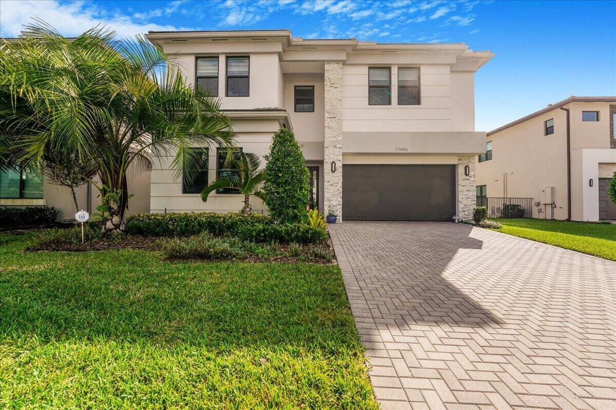 Polynesia Model in Prestigious Lotus Development! This luxurious 5-bedroom, plus loft, 7-bath home features a private pool, gourmet kitchen with quartz countertops, hardwood floors, impact glass, and a 2-car garage. Enjoy the 27,000 sq ft clubhouse with two pools, restaurant, kids' splash area, gym, basketball courts, tennis, pickleball, and more. Located in the high-end GL Corridor with new shops, plazas, and easy highway access.
