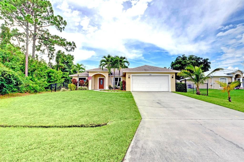 Photo of 2930 SW Ortega Street, Port Saint Lucie, FL 34953 (MLS # R10727709)