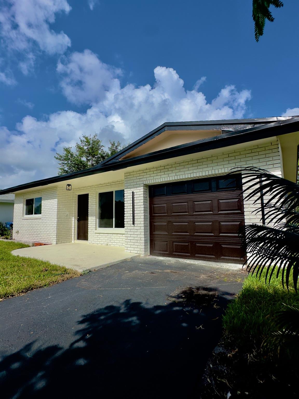 Fully Renovated 3 Bed 2 Bath Lakefront Home in sought after Palm Aire! This Move-in ready 1car garage home sits on a large lake with stunning views. Upgrades include new impact windows/doors, brand new landscaping, new porcelain tiles and luxury vinyl plank flooring throughout. Brand new kitchen/appliances, brand new bathrooms, Electrical and impact garage door! Enjoy new recessed lighting, new interior and exterior paint, and a brand new full AC system for year-round comfort. Open layout offers modern style and functionality, perfect for everyday living or entertaining. Step into your backyard with peaceful lake views—ideal for relaxing mornings or sunset evenings. Centrally located near shops, highways, entertainment and hospitals. Don’t miss this rare lakefront gem Palm Aire Call today!