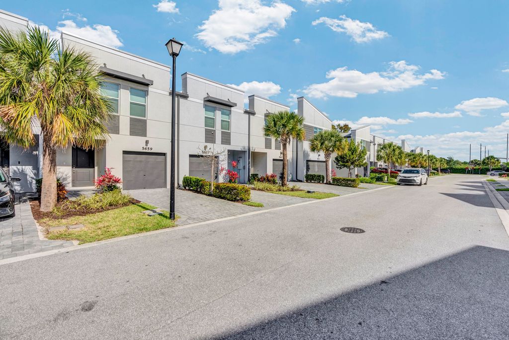 Photo of 5659 Enclave Drive, Riviera Beach, FL 33407 (MLS # B26019525)