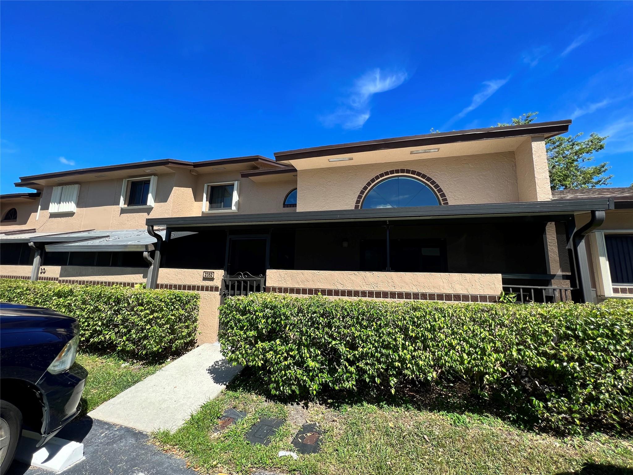 Amazing townhome located in beautiful Centura Parc, all ages, gated community, in Coconut Creek. Lovely 3 Bed/3 bath home has been completely renovated with 2 master bedrooms. One on first floor w/ensuite and patio doors to private outdoor patio; 2nd Master Bed on 2nd flr w/gorgeous tile floors, ensuite & large walk-in closet. Beautifully tiled throughout 1st floor; kitchen w/ granite countertops/cooktop, customized cabinets & stainless-steel appliances. Living/dining room with large windows and access to enclosed patio. Plenty of closets/storage and washer/dryer. Impact windows and doors. Enjoy resort-style living centrally located to 1-95 and turnpike. Incredible amenities include clubhouse, special events, pool, jacuzzi; gym; basketball; tennis; pickle ball; and much more.