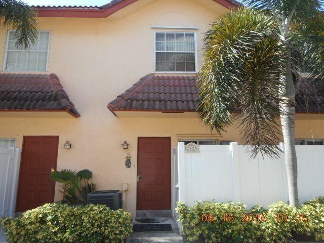 Spacious and beautifully maintained 2BR, 2.5BA townhome in a highly sought-after area. Open-concept upgraded kitchen w/ granite countertops, stainless steel appliances, breakfast bar, and in-unit washer/dryer. The expansive living room features a half bath and ample storage, leading to a tropical patio—perfect for relaxing or entertaining. Upstairs, you'll find two generously sized bedrooms, each with its own private bath and large closet. The primary suite has a private balcony overlooking the pool w/ BBQ & party area. Additional features: two assigned parking spaces directly in front of the unit. This home is just minutes from the dog park, beach, new pier, and an exciting variety of new restaurants and shops. Can be rented immediately. Dogs OK.