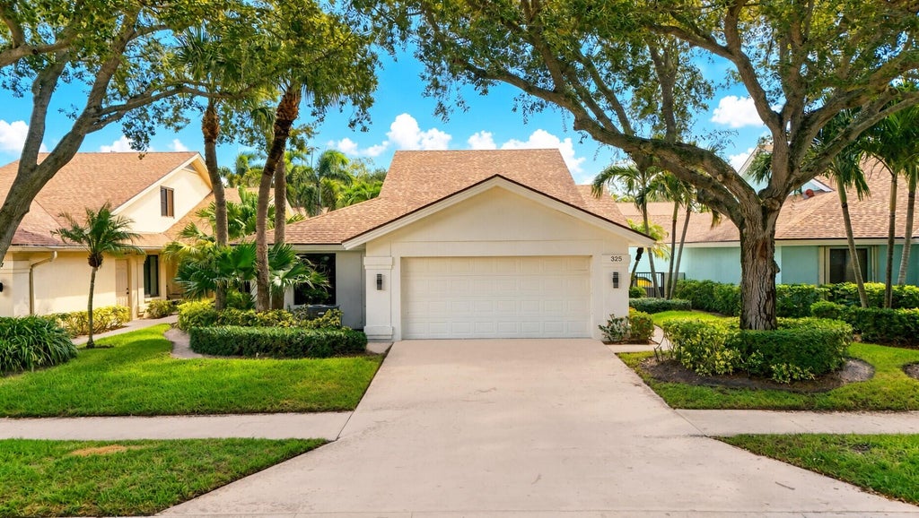Photo of 325 LEEWARD Drive, Jupiter, FL 33477 (MLS # B26085780)