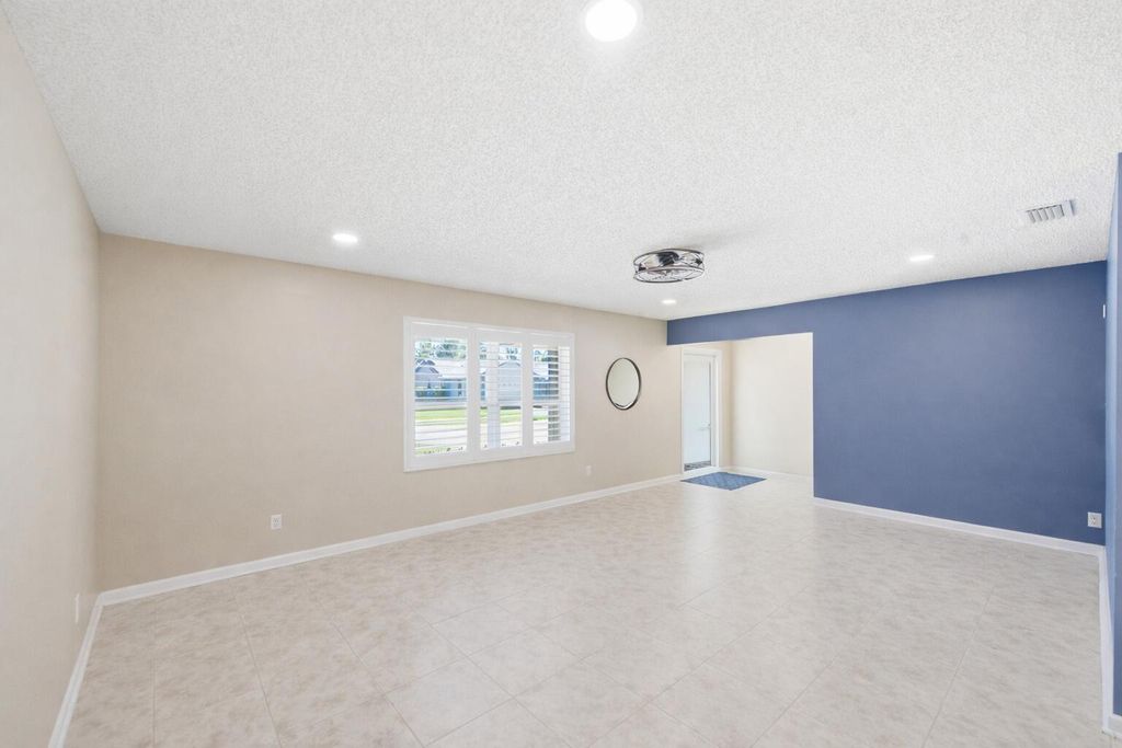 Photo of 1207 Sea Pines Lane, Lantana, FL 33462 (MLS # B26008019)