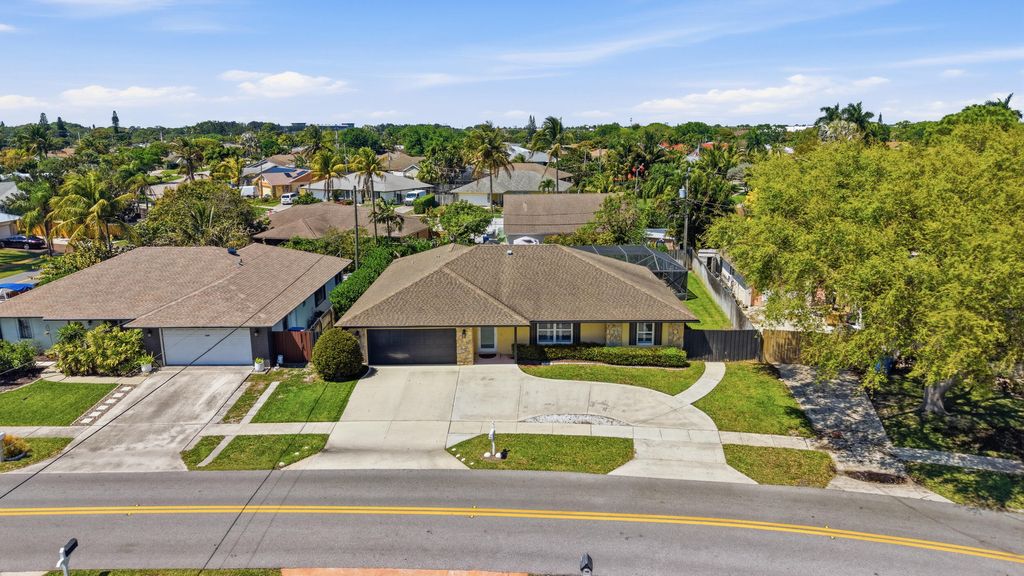 Photo of 1207 Sea Pines Lane, Lantana, FL 33462 (MLS # B26008019)