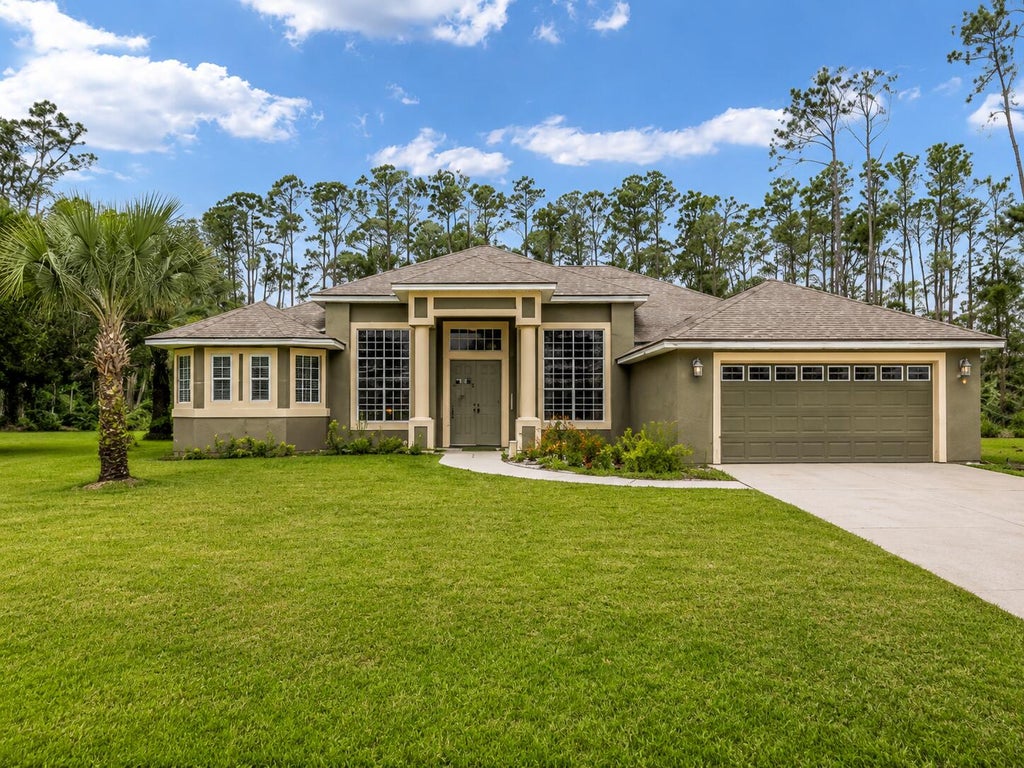 Photo of 77 Eastwood Drive, Palm Coast, FL 32164 (MLS # B26016255)