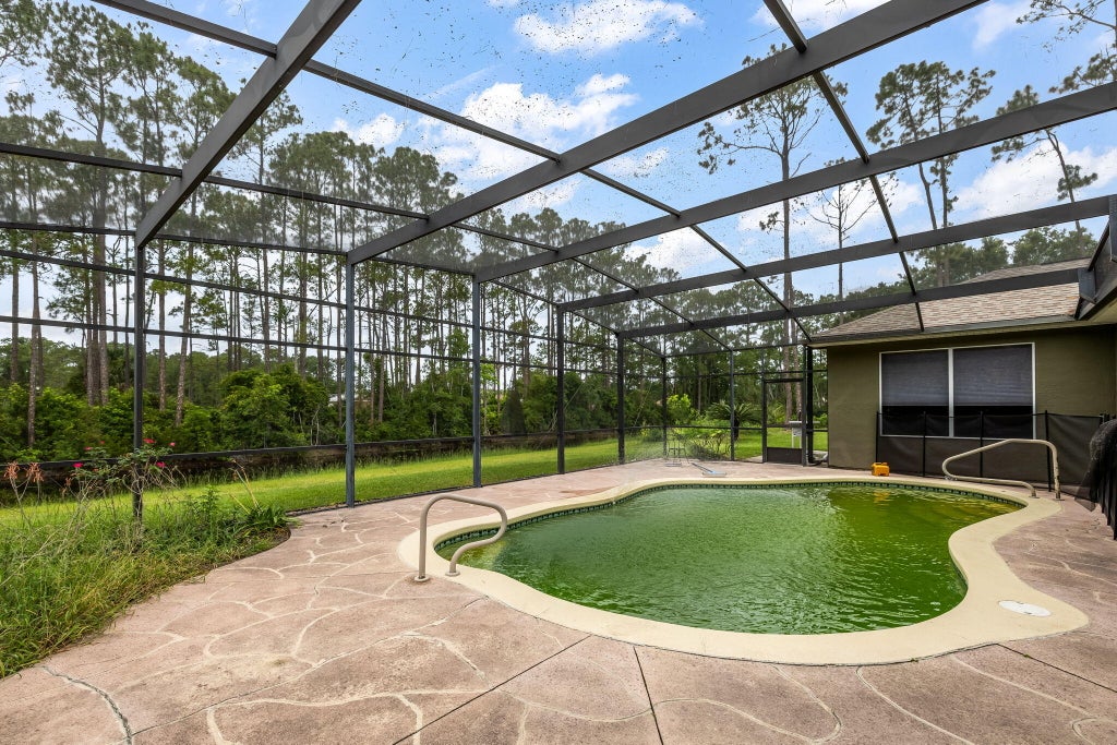 Photo of 77 Eastwood Drive, Palm Coast, FL 32164 (MLS # B26016255)