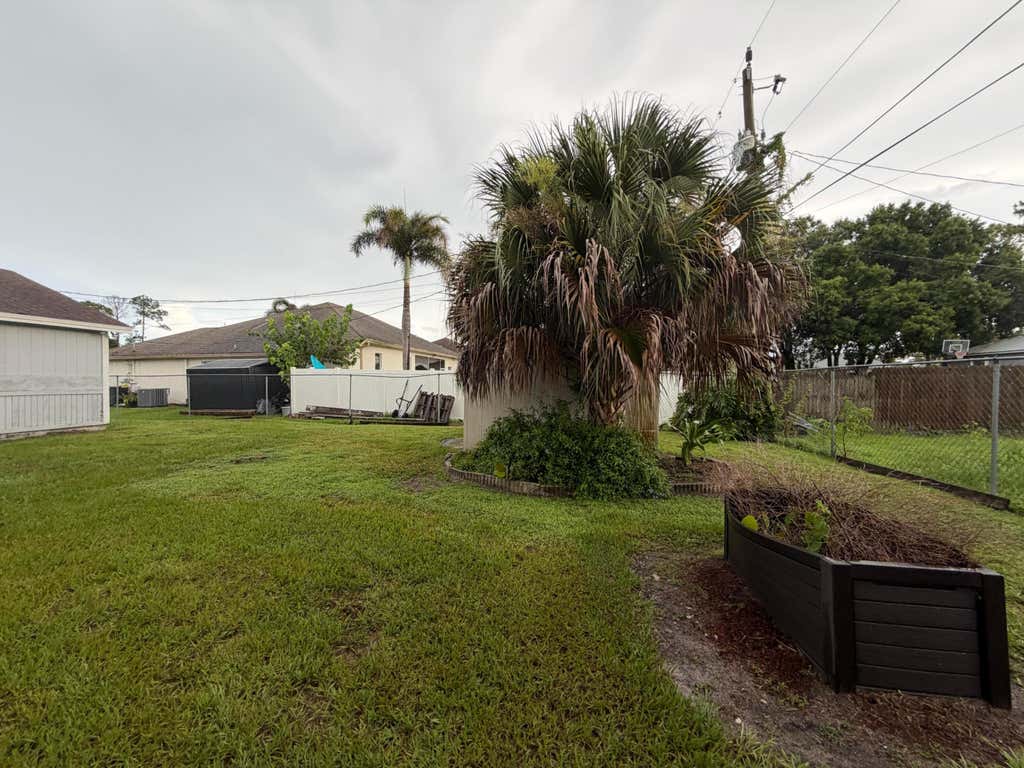 Photo of 3512 SW VOLLMER Street, Port Saint Lucie, FL 34953 (MLS # B26056904)