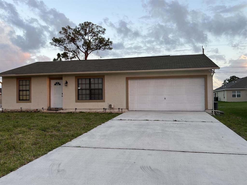 Photo of 630 SW Hoffenberg Avenue, Port Saint Lucie, FL 34953 (MLS # R10883531)