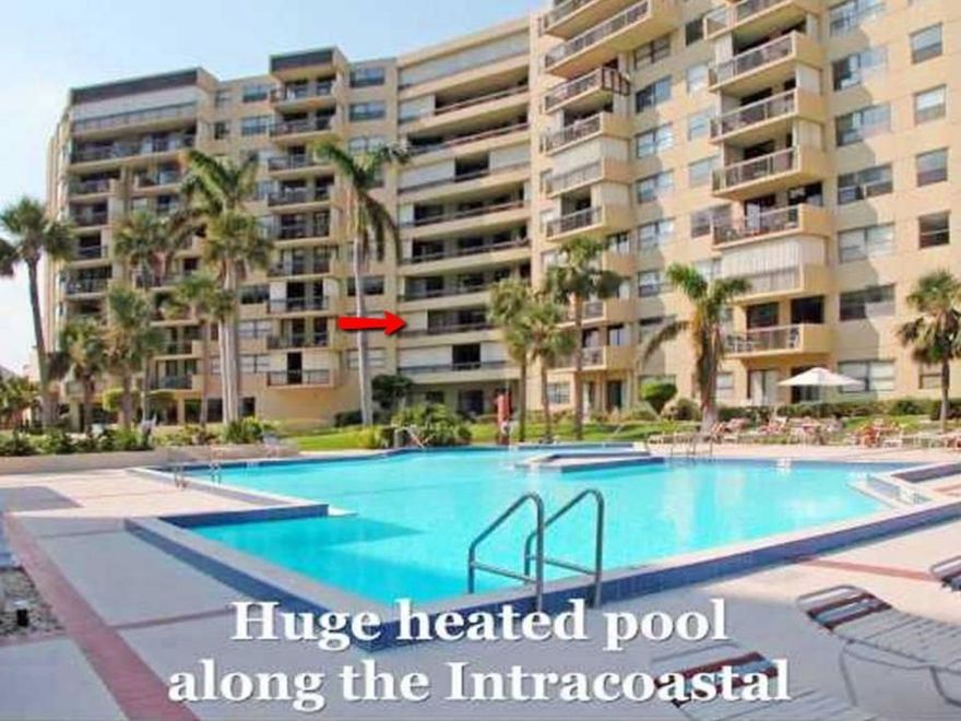 Rarely available SE exposure unit overlooking the pool and intracoastal. Large 1750 sq. ft. wedge shape unit, freshly painted with crown molding and high baseboards. Split floor plan w/2 master suits w/walk-in closets. Open living area and both bedrooms all exit to 39' covered balcony.  Extra large updated eat in kitchen with pantry, washer/dryer in unit, 24/7 security, garage parking and guest parking, gym, heated pool, community room. Great location! Minutes to beach. 2 pets welcome up to 25 lbs. each.