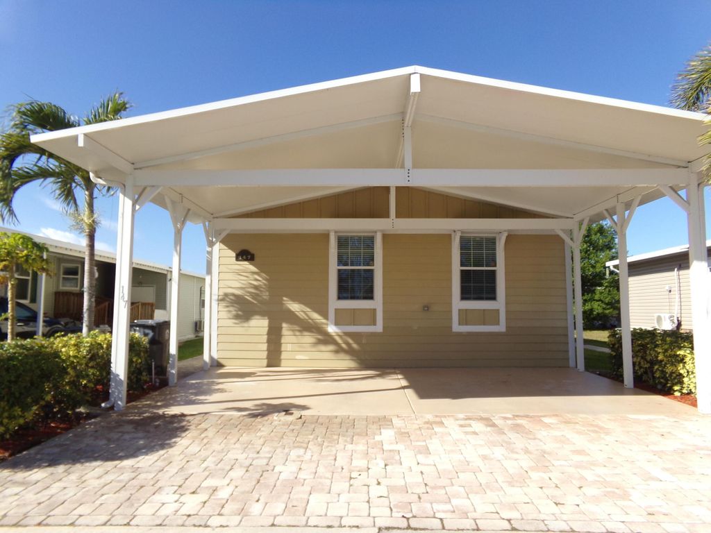 Photo of 147 Plantation Boulevard, Greenacres, FL 33467 (MLS # B26000660)