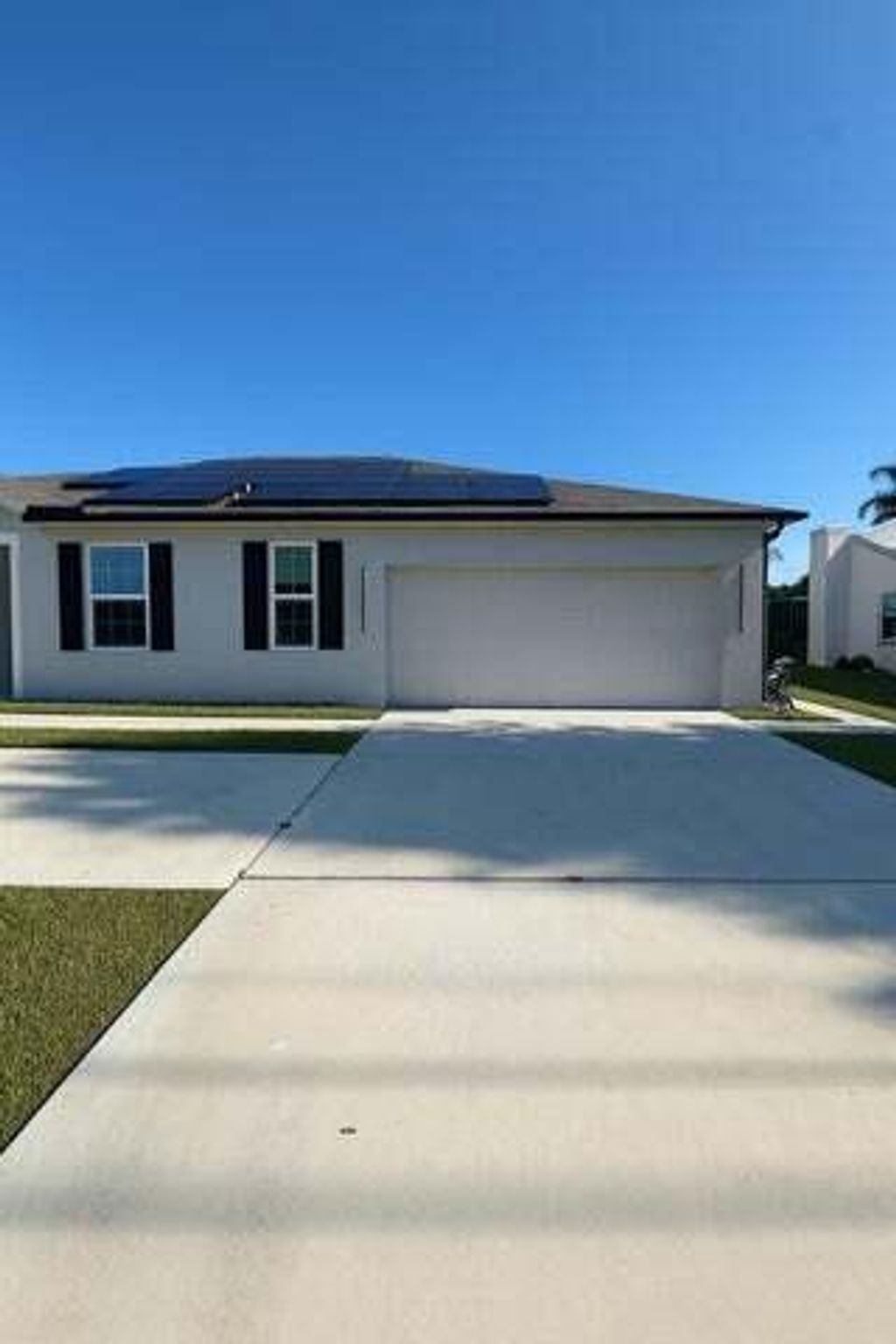 Photo of 1963 SW Import Drive, Port Saint Lucie, FL 34953 (MLS # B26010421)