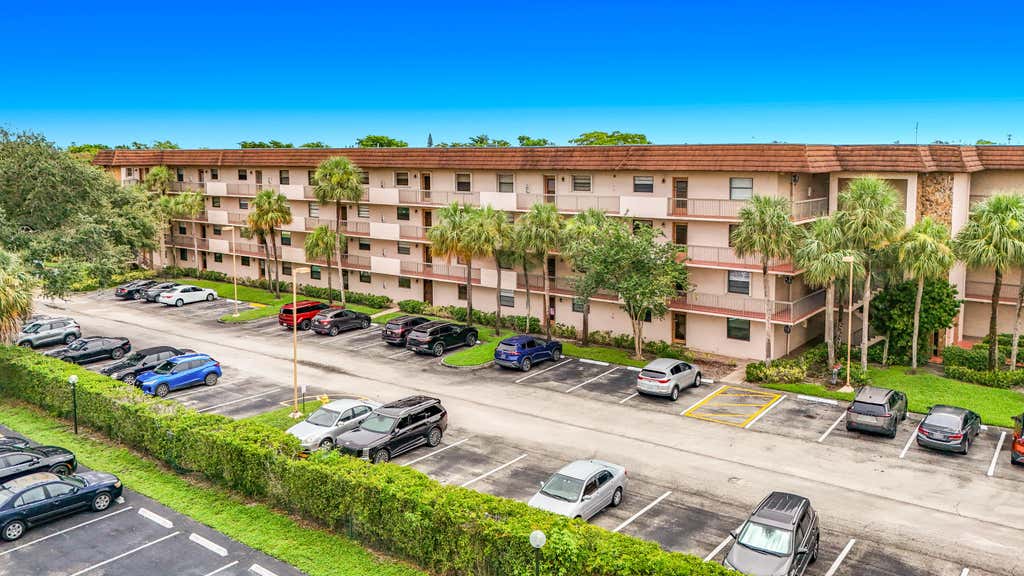 Photo of 4970 E Sabal Palm Boulevard, Tamarac, FL 33319 (MLS # B26061757)