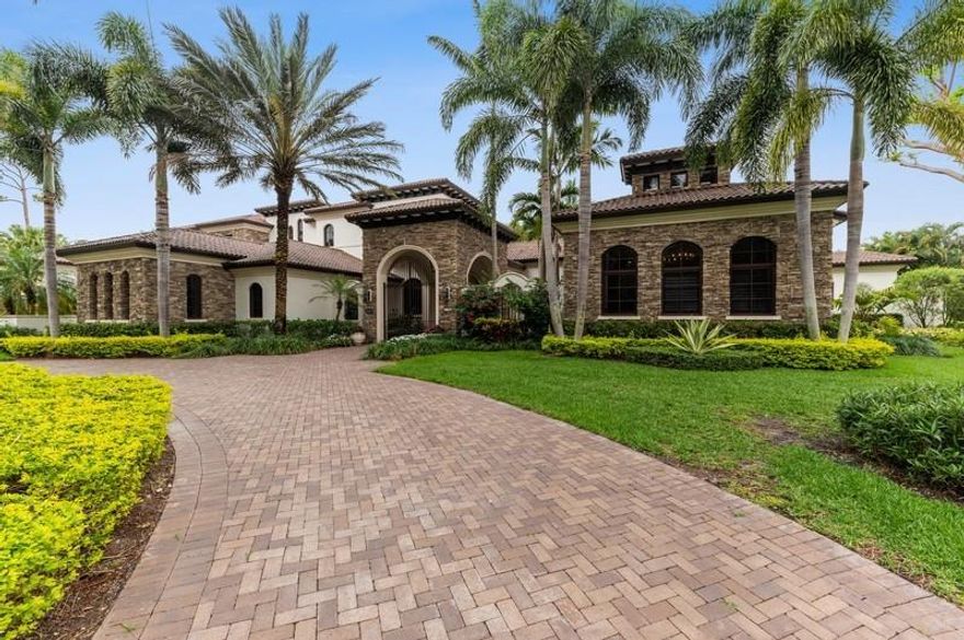 7709 Wood Duck Drive is nothing short of an architectural masterpiece! The home is nestled on a .92 acre lot in the most prestigious section of Boca West Country Club. Built in 2010, this home has 10,200 square feet of living space plus two garages fitting eleven cars. The home was constructed in a transitional style and looks as new as the day it was moved into. With six bedrooms, six baths and two half bathrooms, this home was designed by Franky & Associates Architects and built by Tuscan-Harvey Estate Homes. Within its living space is a separate apartment/guesthouse, perfect for guests or live in staff.

With a beautiful lake view, adjacent to the large family room lies the chef's kitchen. This kitchen holds a large Island, Wolf stove, Miele Double Galley Refrigerator, and two Miele Dishwashers, one of which is especially designed for china and fragile dishes. Behind the salt water pool lies a dock that permits a small electric motor or a rowboat. This is the only property in the community with such a privilege. 

Throughout the structure, one will note that the millwork and finishes are undoubtedly remarkable. Every square inch of the home was meticulously planned and built. From the master bathtub which was carved from a single solid Jerusalem Stone, to the outdoor kitchen which at the push of a button becomes completely enclosed with phantom screens, the seller thought of everything.

It is important to recognize that the details don't just end with what you see, rather it's also what you don't see that helps make this property a true gem. Two hot water heaters give both redundancy and reach to more than adequately service the whole building. A full house generator fueled with two 1,000 gallon tanks allows the property to go without external power for up to two weeks. In addition, the plumbing system has two feeds which gives powerful water pressure throughout the home. Furthermore, eight air conditioning units keep this massive structure cool. This home is ideal for those seeking a luxurious South Florida lifestyle.