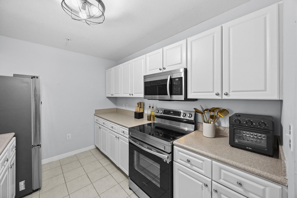 Photo of 1203 Town Center Drive #312, Jupiter, FL 33458 (MLS # B26014914)