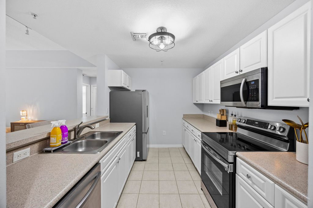 Photo of 1203 Town Center Drive #312, Jupiter, FL 33458 (MLS # B26014914)