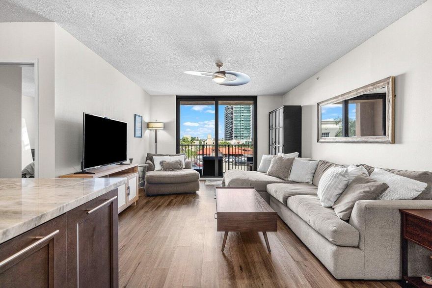 Welcome to modern luxury living in the heart of West Palm Beach! This beautifully updated 2-bedroom, 2-bath residence at The Tower blends contemporary style with everyday comfort, just steps from the energy and convenience of downtown.Step inside to discover a stunningly renovated kitchen, featuring rich espresso cabinetry, stainless steel appliances, sleek hardware, and gorgeous stone countertops with an expansive peninsula--perfect for entertaining. Warm wood-look flooring flows throughout the home, enhancing the open-concept living and dining area that leads to your private balcony.The spacious primary suite offers a peaceful retreat with ample closet space and an updated ensuite bath. A well-appointed second bedroom and full bath complete this home.