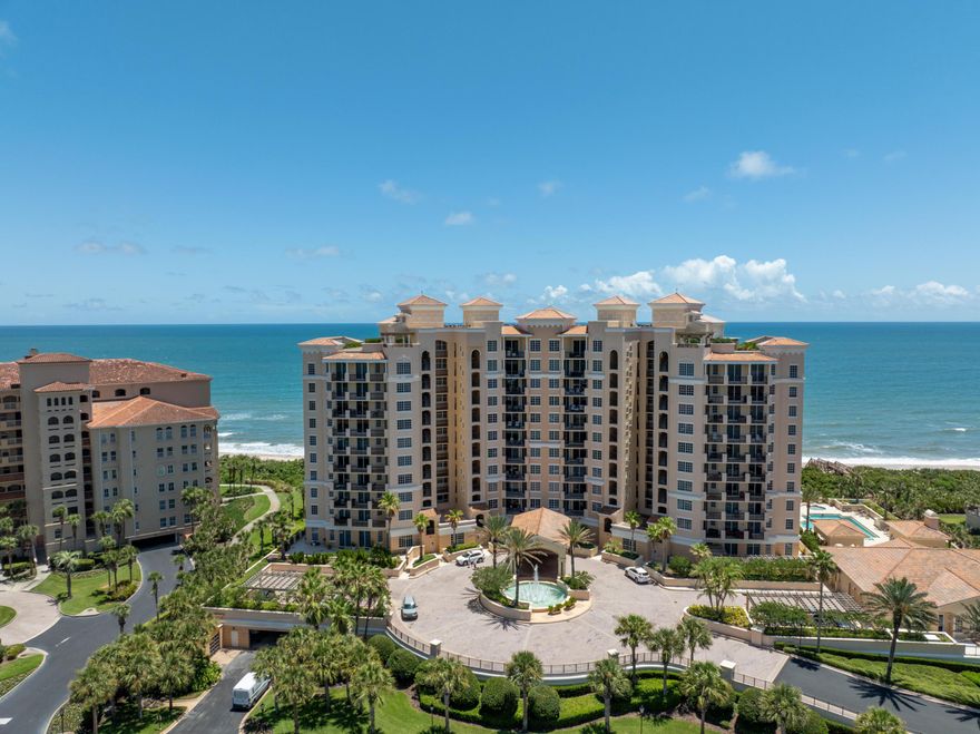 An Elevated Oceanfront Experience | Cambria at Hammock Dunes Arrive by private elevator into a striking direct oceanfront residence where the horizon stretches endlessly and every detail has been thoughtfully refined. From the moment you step inside, 24" polished porcelain floors and unobstructed Atlantic views create an immediate sense of scale, light, and elevated coastal living. The home lives larger than its footprint, thanks to Cambria's recently refreshed private guest suites available exclusively to residents—perfect for hosting friends and family. Bathrooms were recently transformed (12/25) with porcelain tile floors, showers and surrounds, Brizo plumbing valves and fixtures and black leather quartzite vanity tops. The entire condo was also repainted at this time.  The kitchen features modern appliances, along with a full-size washer and dryer in the laundry room, and newer Trane HVAC, water heater and dehumidification system. Ownership includes two assigned garage parking spaces, a private air-conditioned storage unit, and the peace of mind of a gated oceanfront community with 24-hour security. Cambria offers a resort-caliber amenity collection: direct beach access, an oceanfront heated pool and spa, fitness center with sauna and steam room, golf simulator, theater, wine room, and more. Optional membership to the prestigious Hammock Dunes Club unlocks an even higher level of luxury with private golf, dining, and curated social experiences. This is more than a residence—it's a front-row seat to the Atlantic, within one of Florida's most exclusive coastal communities.