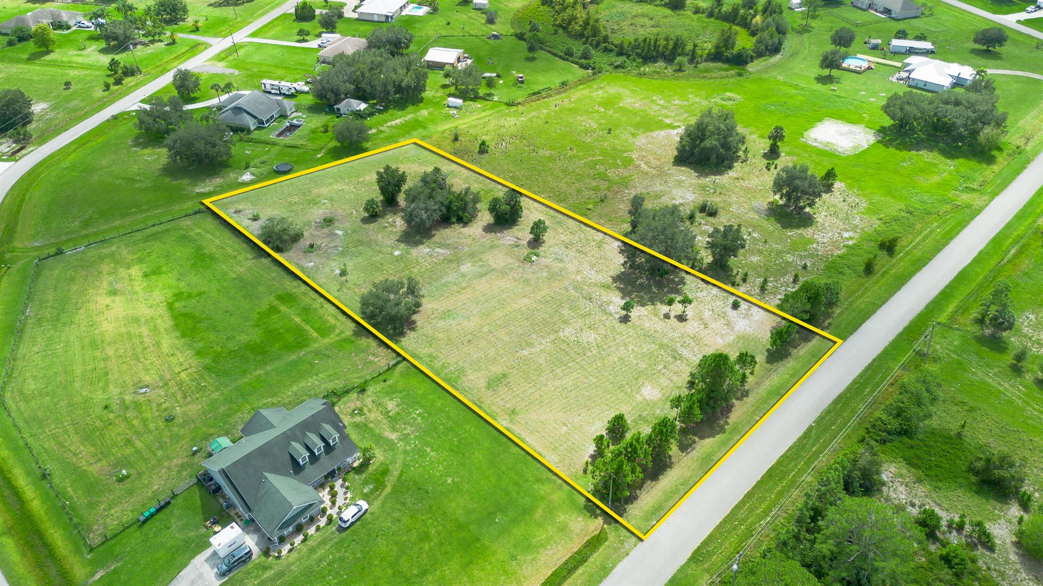 ''Welcome to your perfect piece of paradise! This expansive 2-acre parcel is completely high and dry, ensuring you're not in a flood zone. Situated in the desirable RBar neighborhood, the property has been thoughtfully cleared while preserving a few beautiful trees, offering the ideal balance of open space and natural beauty. With ample room to build your dream home, enjoy peaceful living in a well-maintained community. Don't miss this opportunity to own a prime lot in this highly sought-after area!''HOA