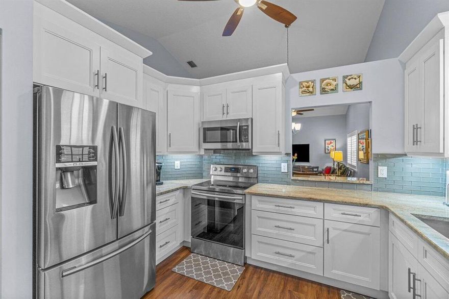 Rare opportunity with this renovated waterfront villa in the coveted Emerald Pointe community.  As you enter your eyes will be drawn to the height of the vaulted ceiling and gorgeous upgraded flooring that flows throughout the whole residence. You have a beautifully renovated kitchen with white shaker cabinets, stainless steel appliances, decorative crown molding, granite counters and views of both the family and living room areas. As you walk further you will see the transition of the open dining area into the oversized living room with high hat lighting. You have lake views from the living room and both bedrooms. In the primary suite you have dual closets with one being a walk in, double vanity and a large class enclosed shower. The patio is fully enclosed. In the guest bedroom you have lots of natural light with three windows and one slider with patio access.  The laundry room offers lots of room and extra storage.  Emerald Pointe offers a clubhouse, tennis, pickleball, community pool, and much more.  Schedule your showing today.