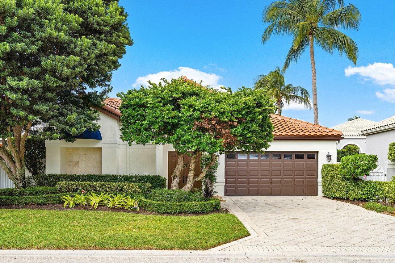 Rarely available, gut renovated and ready for immediate move-in, in Clubside at Woodfield CC. Enjoy your own private courtyard as well as a backyard with golf course views. With 4 BR, and 4.5 baths, this bright and spacious one-story home includes all new: roof, impact windows, custom wood doors, wide plank porcelain flooring that looks like wood, wood-planked ceilings, painted and smoothed walls and baseboards, and custom built-ins. All new appliances, including all A/C units, washer/dryer, hot water heater, Sub-Zero fridge, 4 Sub-Zero freezer drawers, Miele dishwasher, and AGA ''Elise'' oven and stovetop. All home lighting and wiring is new as well. Additional features include a reverse osmosis water system and electric blackout shades in bedrooms.