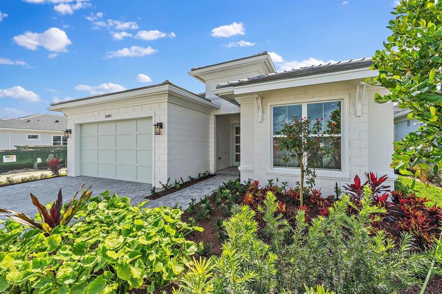 THE ONLY NEW CONSTRUCTION MOVE-IN READY HOME IN PALM BEACH GARDENS!!! ABSOLUTELY STUNNING 4-bedroom waterfront home located in the highly sought after community of Avenir. Upgrades galore!! The owners spared no expense in designing this gorgeous house. High end cabinets, flooring, countertops, light fixtures throughout and more!! Outdoor patio + summer kitchen is a perfect extension of your living space- great for entertaining and BBQ's! Plenty of room for a future pool. Enjoy beautiful lake views on this premium waterfront lot- one of the best in the entire community! The master suite is an absolute spa oasis with massive his/her closets; oversized stand up shower with bench seating; luxurious soaking tub and beautiful double vanities which carry the quartz countertop design throughout the entire home. The kitchen is a total dream!!! HUGE island with tons of storage space- perfect for the ultimate chef and hostess! There was so much attention to detail when designing this kitchen- owners selected the highest level of cabinets and waterfall quartz countertops to include ss appliances, wine fridge and glass pantry doors to carry the design throughout the home. DO NOT MISS THIS OPPORTUNITY TO LIVE IN A BRAND NEW HOME IN PBG!!