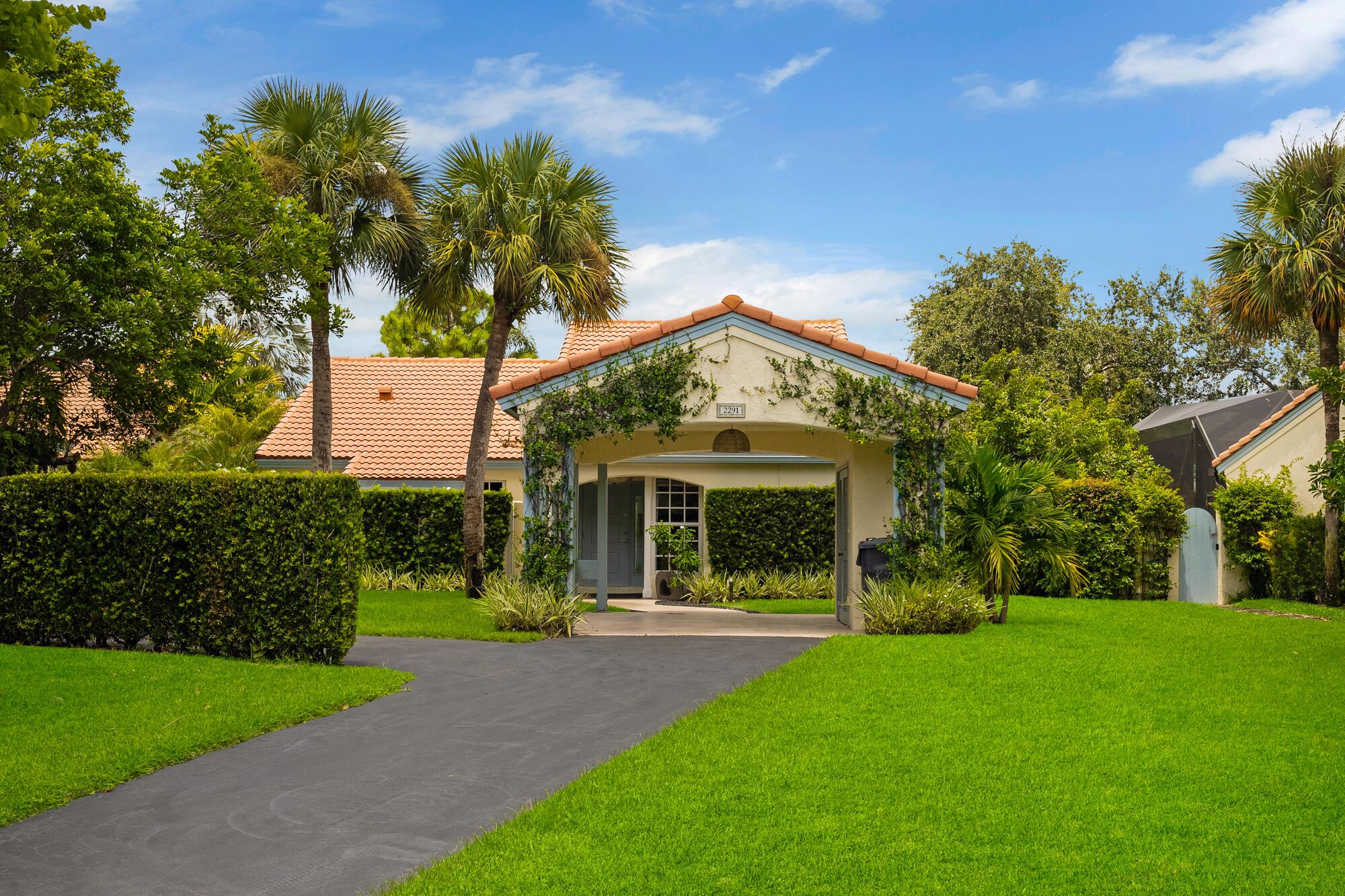 Renovated designer townhome located within the prestigious Palm Beach Polo and Country Club, a world-renowned community in Wellington, known for its upscale living and equestrian focus. The open concept with its modern kitchen, stylish baths, and natural light offers ample living space with unique architectural designs and luxurious finishes. The large patio overlooks the beautiful sparkling private pool with a view of the natural water and fountain for a tranquil setting. Enjoy high end amenities including manned gate access, tennis, pickleball, professional lessons, full gym, and hiking and biking within the nature preserve.