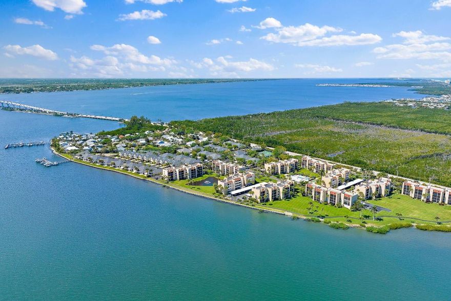 Premium waterfront condo with panoramic Indian River Lagoon views! Beautifully renovated 2BR/2BA residence ready for immediate move-in. Features a new white quartzite custom kitchen with upgraded appliances, utility area with updated washer/dryer, hurricane impact windows and doors, and a new tankless water heater. Light and bright interior offers volume ceilings, recessed lighting, new fans, plantation shutters, upgraded tile floors, and renovated baths. Custom touches include lighted glass display cabinetry and a quartzite buffet ideal for entertaining. Owner's suite features a walk-in closet with custom built-ins. Flexible floorplan includes guest suite/den with walk-in closet and updated bath. Resort-style community with riverfront walking path, clubhouse, two pools, tennis, and more!