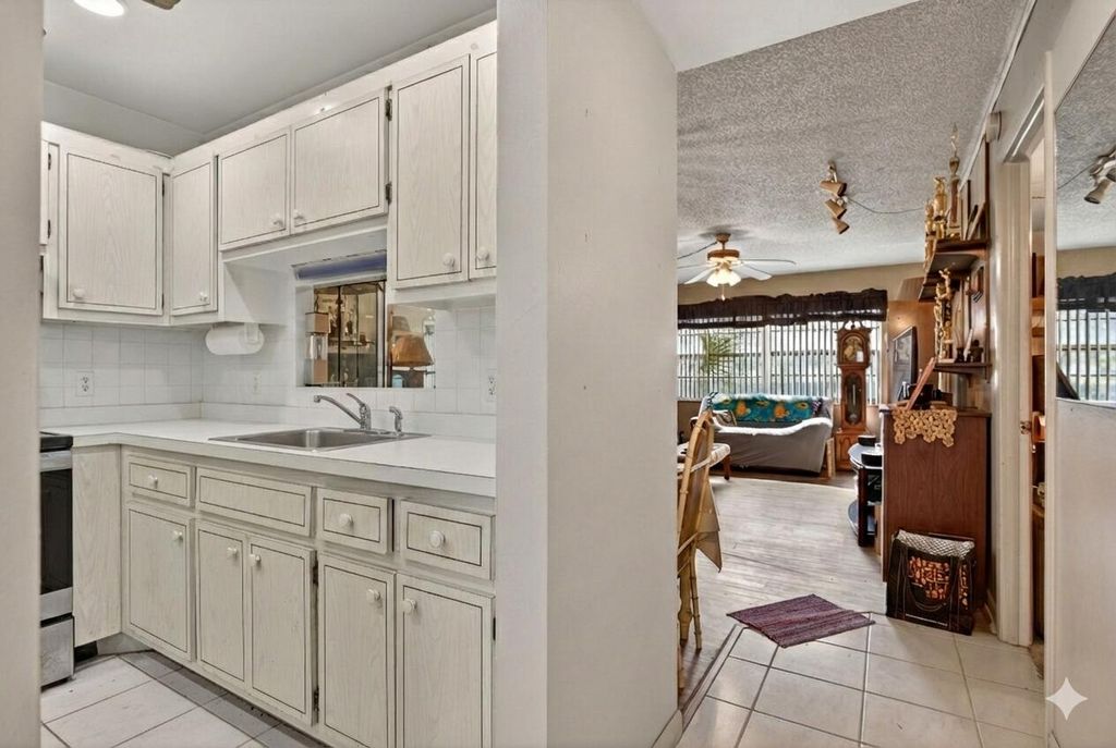 Photo of 5111 W Oakland Park Boulevard #105, Lauderdale Lakes, FL 33313 (MLS # R11161253)