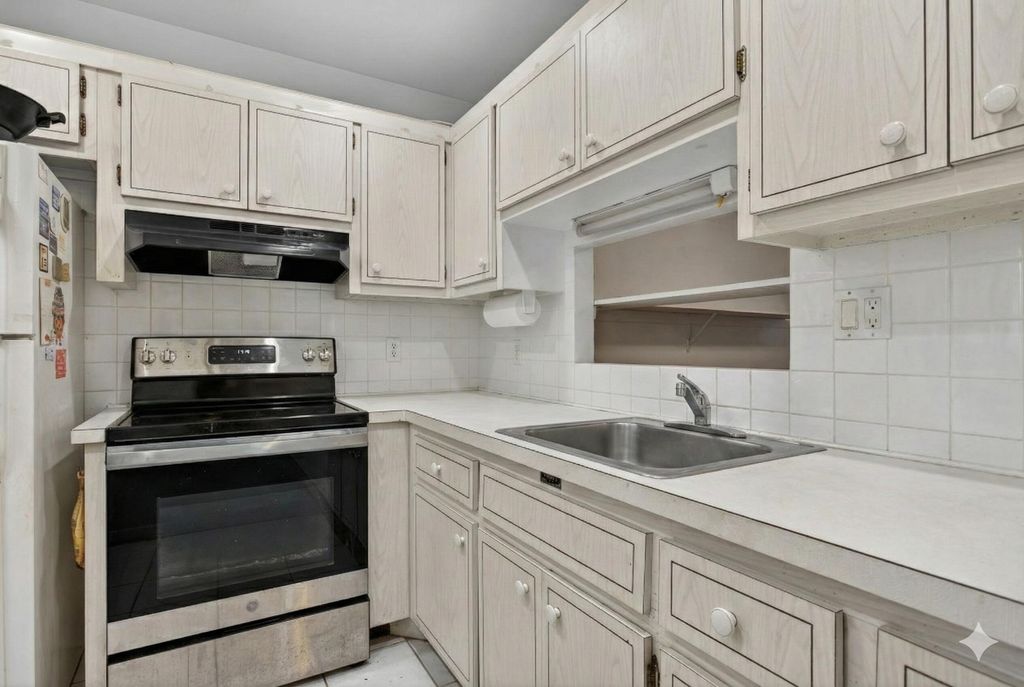 Photo of 5111 W Oakland Park Boulevard #105, Lauderdale Lakes, FL 33313 (MLS # R11161253)