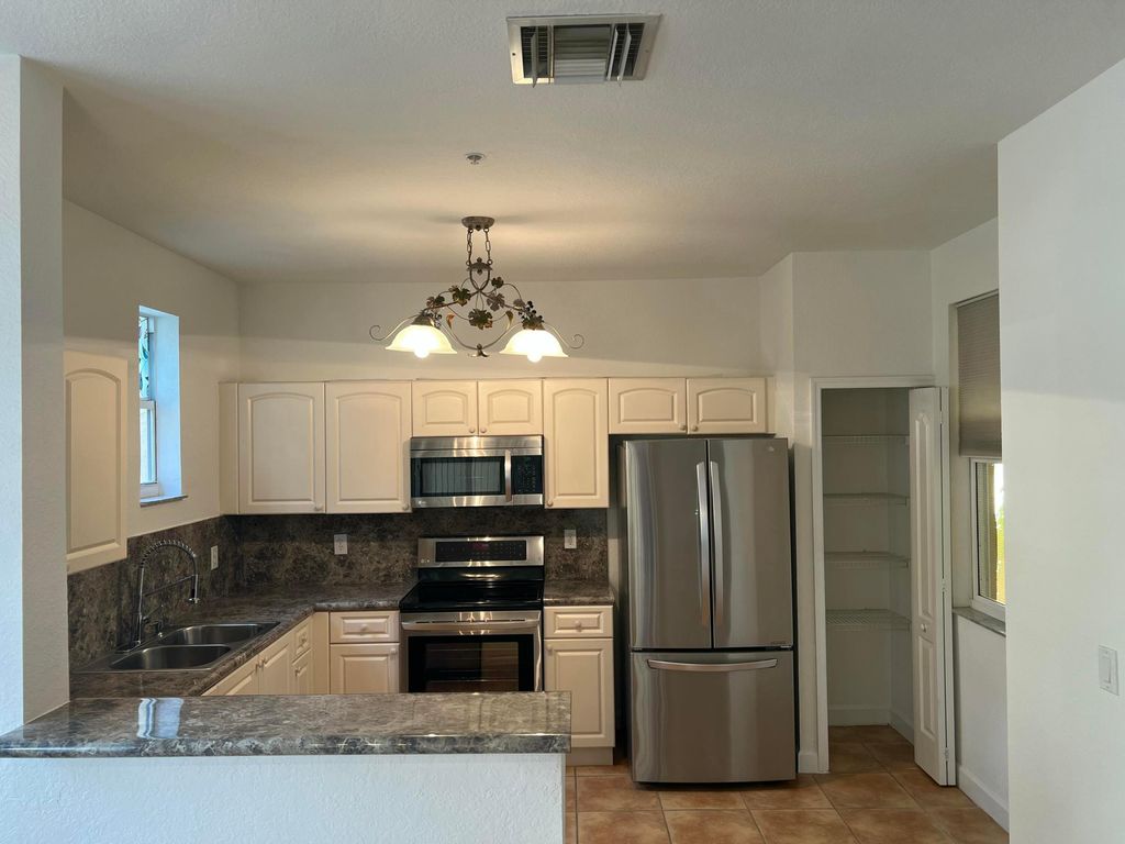 Photo of 150 Jacaranda Country Club Drive #102, Plantation, FL 33324 (MLS # B26000079)