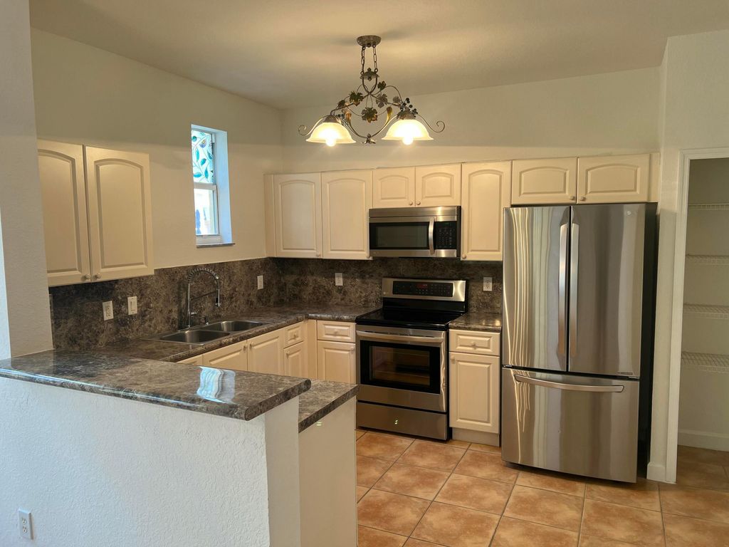 Photo of 150 Jacaranda Country Club Drive #102, Plantation, FL 33324 (MLS # B26000079)