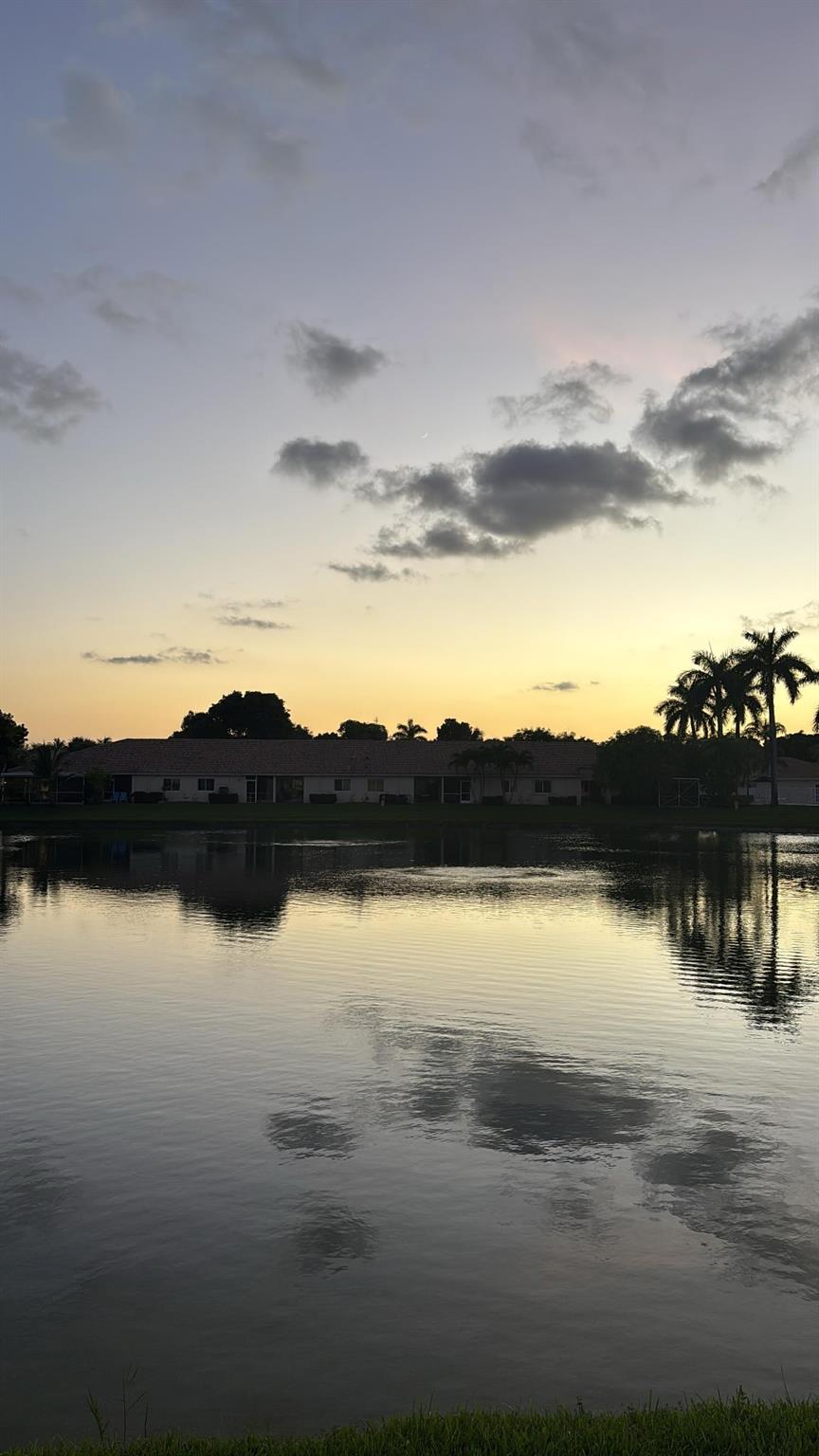 Welcome to Paradise. Beautiful waterfront unit with gorgeous water views located in Banyon Oakbridge which is a gated community conveniently located near Fort Lauderdale International Airport, Port Everglades Seaport, Hard Rock Guitar Hotel and Casino, Houses of worship, Dania Pointe, and walking distance to Publix. This spacious townhouse is tastefully decorated. It offers a screened in patio with water views. The 2nd floor has two spacious bedrooms with a shared large bathroom. Wall to wall custom closets. The entire home was updated several years ago. There are water views from the 2nd floor. Unit can be leased. The community is oversized and plenty of space to walk and enjoy peacefully. The swimming pool is also lake front and has amazing views. Don't miss out on this opportunity.