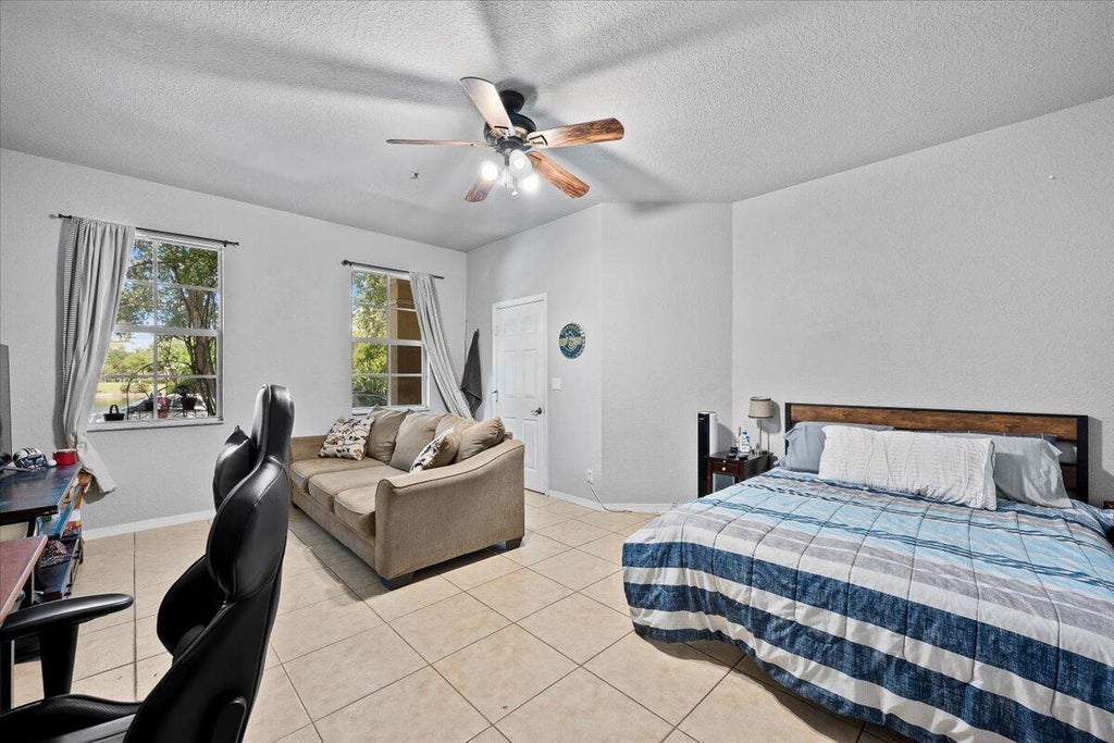 Photo of 335 E Thatch Palm Circle #104, Jupiter, FL 33458 (MLS # B26063332)