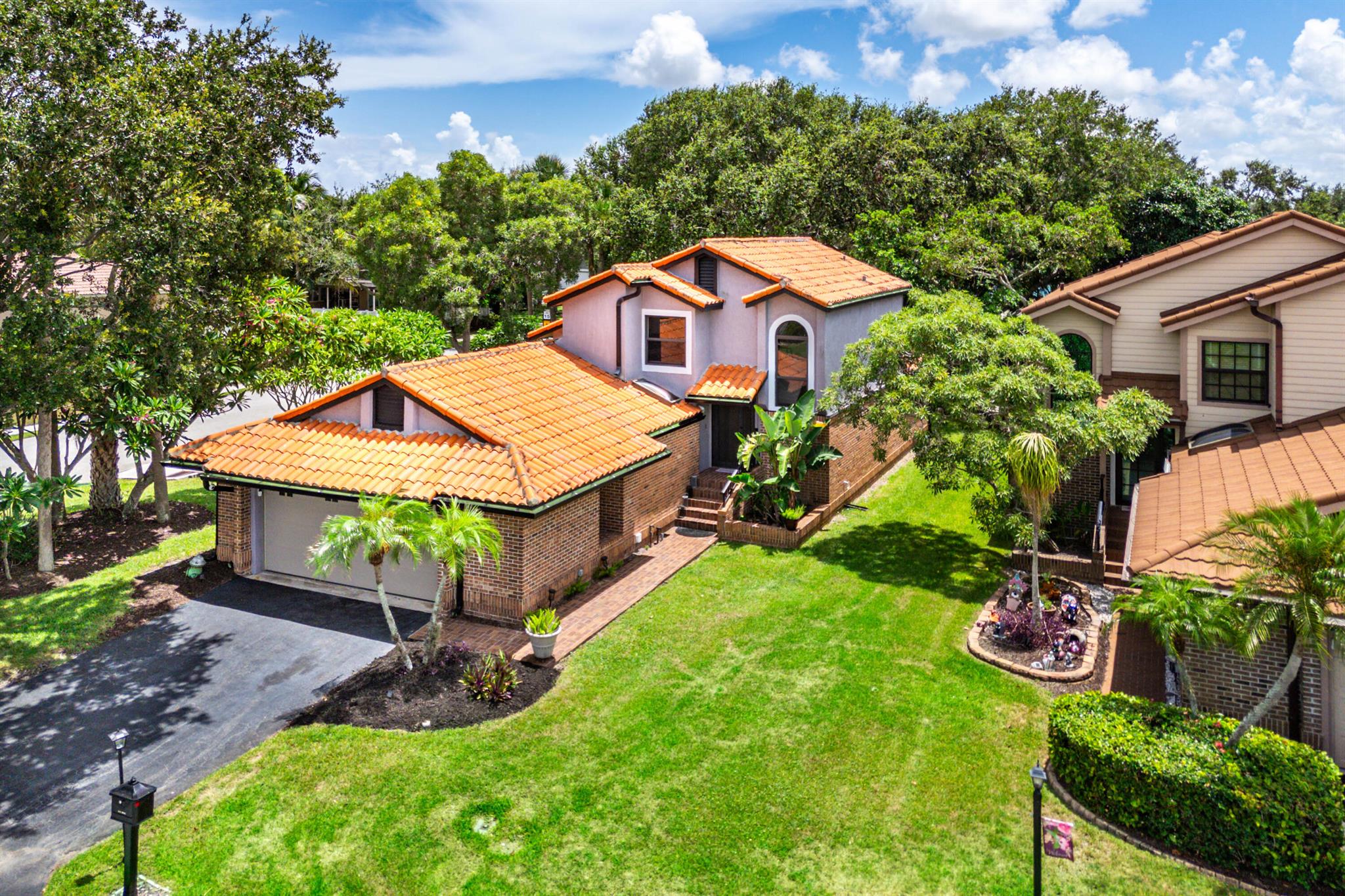 Experience the charm and convenience of Delray Beach living in this former model home, perfectly situated on the largest lot in a serene, tree-filled neighborhood. Boasting 3 bedrooms, 2.5 baths, a spacious 2.5-car garage, and a first-floor master suite, this residence offers modern impact windows and doors for comfort and security. You will love it's custom interior doors and moulding all throughout the home. Just minutes from the coveted Atlantic Avenue lifestyle, this perfectly located home is your invitation to enjoy Florida living at its finest.