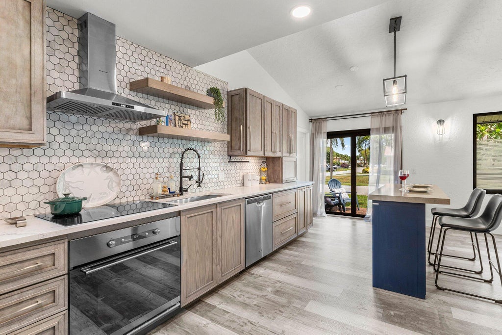 Photo of 4104 NW 2nd Lane, Delray Beach, FL 33445 (MLS # R11114057)