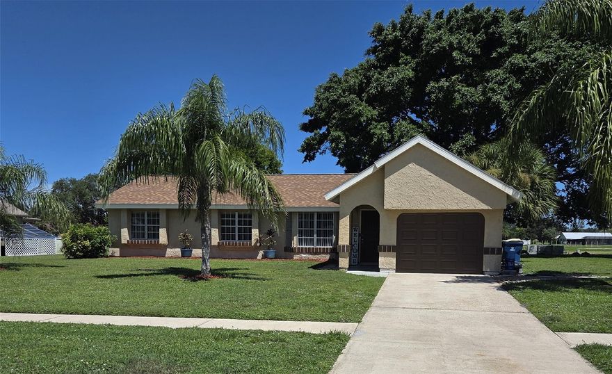 MOVE- IN ready home in desirable area of Palm Bay.  Home has been updated through out with new wood floors, carpet in bedrooms, updated baths, updated kitchen with newer appliances, new electrical panel box, roof under 2 years old, deep well artisan sprinkler system, new garage door opener, new garage Shark floor coating, new fresh paint interior and exterior pain to be finished in 2 weeks, window blinds.  Home has 3   bedrooms 2 baths, separate dining area, a family room and an additional large bonus room, screened in porch in rear of home.  New PVC fence being installed at rear of property for privacy.
Convenient to shopping, schools and main highway.  Minutes from beaches.