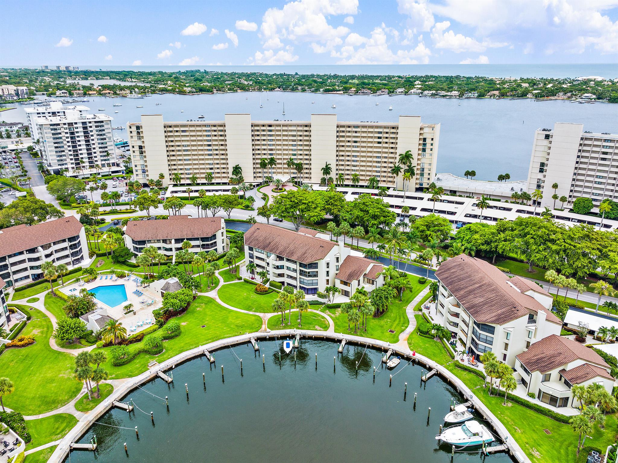 GORGEOUS WATERFRONT condo within the gated community of Old Port Cove. Stunning 4BD/3BA first floor unit, with 40' private boat DOCK, with ocean access and NO fixed bridges. Relax and enjoy the large wrap around terrace with beautiful views of the water. Spacious living room/dining area. The large kitchen is fully equipped with stainless steel appliances, granite countertops, and a breakfast bar. Master suite has 3 walk in closets; dual sinks with spa tub and separate shower. Other features include impact windows, laundry room, wine fridge, and a second private terrace for your guests to enjoy. This GEM truly offers the indoor/outdoor lifestyle that you have been looking for! Steps away from the community heated pool/spa. Golf and tennis available at the notable North Palm Country Club.