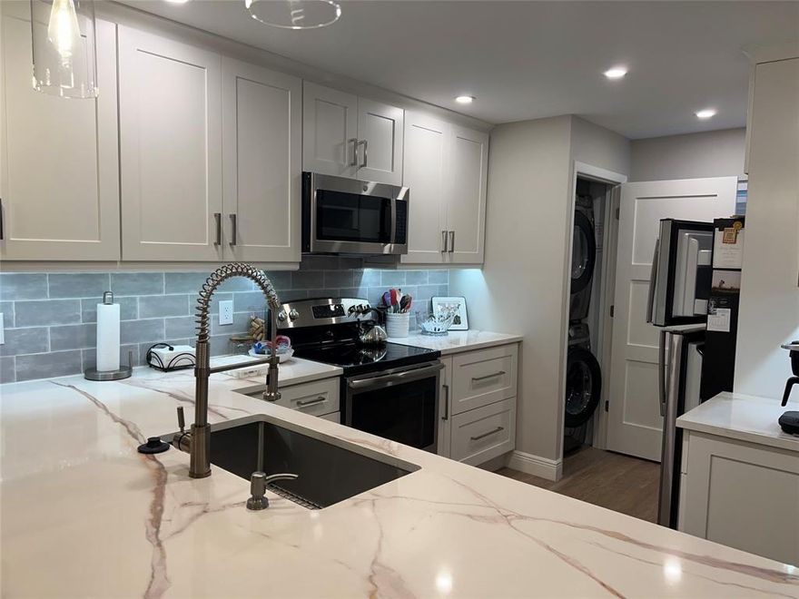 Come stay for the winter in this updated condo. Beautiful water views, all the comforts of home and less than a mile to the beach. Full size front load washer and dryer in the kitchen, covered parking for your car, and everything you need for a relaxing winter stay. Hillsboro Cove is an active 55+ waterfront community with amenities. Close to restaurants, shopping and more.