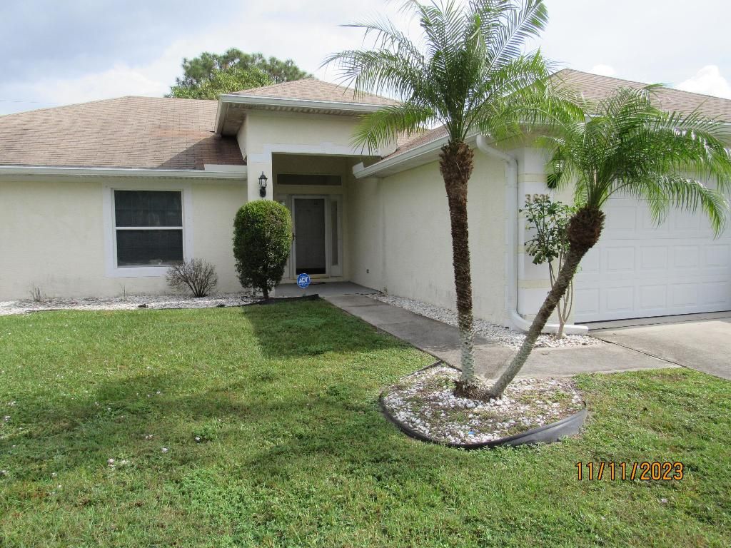 Photo of 3821 SW Janiga Street, Port Saint Lucie, FL 34953 (MLS # R10935669)