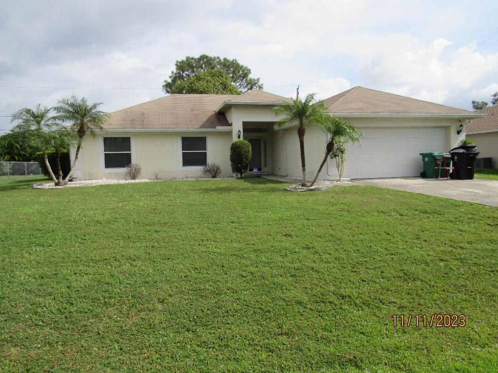 Photo of 3821 SW Janiga Street, Port Saint Lucie, FL 34953 (MLS # R10935669)