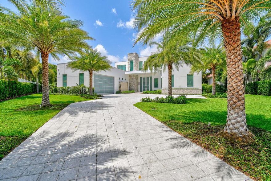 Introducing a newly 2021 built, modern inspired Intracoastal estate, highlighting sophisticated architecture. Superbly situated on an oversized homesite with captivating waterfront views in a no wake zone. Enter this grand, newly built residence to inhale the soaring ceilings, contemporary finishings & stunning pool & Intracoastal views. You will immediately be presented with an impeccable open floor concept, elegant entertaining space, an ultra modern kitchen with an abundantly large island, & floor to ceiling electric impact sliders that assist the view to go on & on. This residence has five bedrooms + office, seven bathrooms, a dramatically large pool/spa & fully equipped smart home.