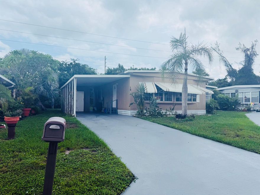 Welcome to this charming 2-bedroom, 2-bathroom manufactured home offering comfort, functionality, and Florida living at its best. Step inside to find an inviting Florida room, perfect for relaxing or entertaining year-round. The updated kitchen and modern flooring create a fresh and stylish feel throughout the home. A newer washer and dryer (2021) add everyday convenience, making this home move-in ready. Outside, enjoy a covered carport, low-maintenance yard, and plenty of space for gardening or outdoor enjoyment. Centrally located near shopping, dining, and beaches--this home is ready for its next owner! Land lease - $833.06 per month.