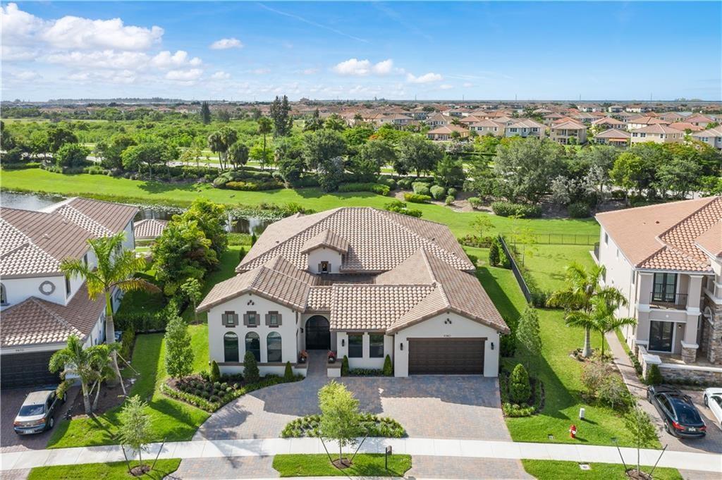 2018 Gen located in the beautiful community of Parkland Golf and Country Club. Parkland Golf & Country Club's premier golf and tennis club! One-story, triple-split, open floor plan features 4BR(ensuite)/4.5BA + den! Spectacular upgrades include impact glass and doors, Quartz countertops, 48" Sub-Zero refrigeration and Wolf appliances, gorgeous kitchen cabinets, wood beam and coffered ceilings, 16-camera 4k system with alarm touch pads, Smart home Alexa enabled for lights, A/C, door locks, garage, nest smoke detectors and doorbell, 500 gallon propane tank, linear A/C vents, solar window tint, pre-wired with speakers in/out, custom built-ins in all closets.