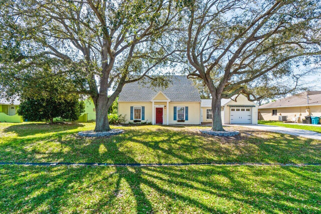 This adorable 4-bedroom, 3-bathroom home is located in the heart of Port St. Lucie! This property offers modern updates while retaining its original Cape Cod character. The galley kitchen was remodeled in 2022 and modern updates include a new water heater and roof last year. Fully mature trees dot the expansive yard, providing cooling shade in the front. The back of the home boasts a gazebo and fencing--making this home perfect for playing, relaxing, or gardening. Natural light shines through the house but it needs your touch to make it home.